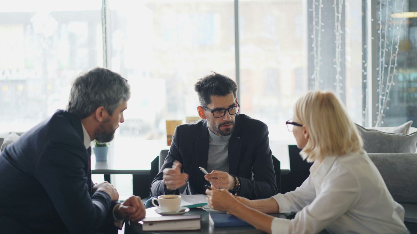 Tax Khabari advisors in conversation with a client, reviewing documents together